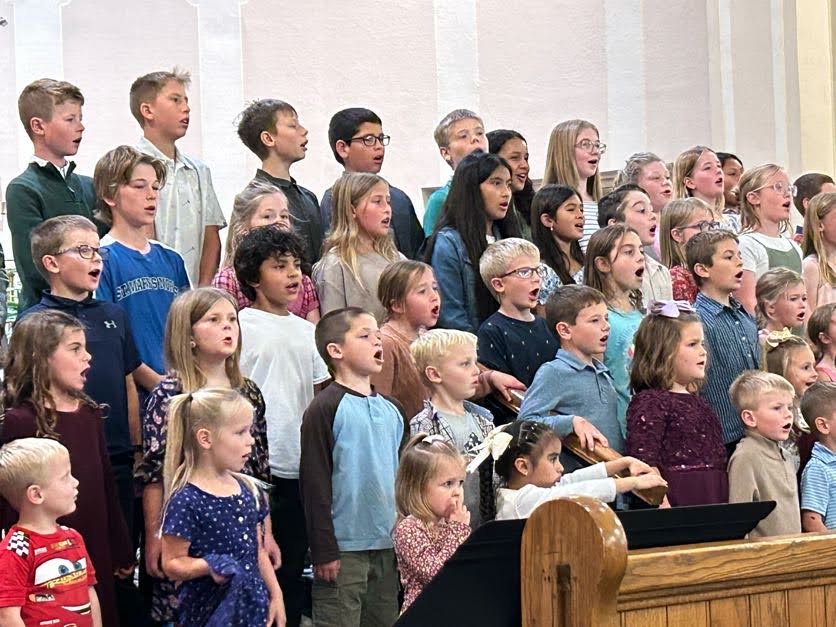 Group of children singing in a school concert